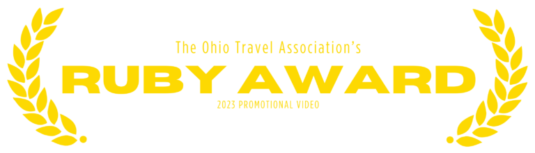 Yellow graphic with leaves on the left and right side of text saying, "The Ohio Travel Association's Ruby Award, 2023 Promotional Video"